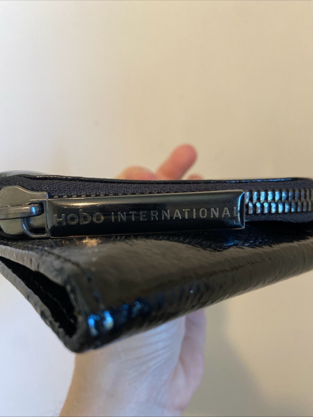 HOBO Black Patent Fold-Over Clutch with Diagonal Zip Magnetic Closure - Picture 2 of 15